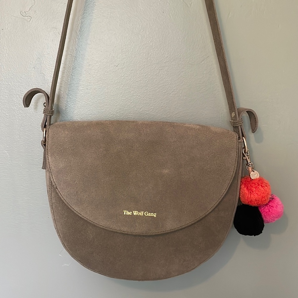 100% suede olive green shoulder bag with Pom Pom tassel